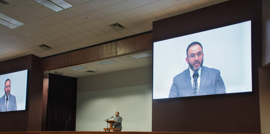 political leader speaking at podium